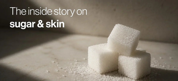 Three white sugar cubes on a stone surface with the heading "The inside story on sugar & skin".