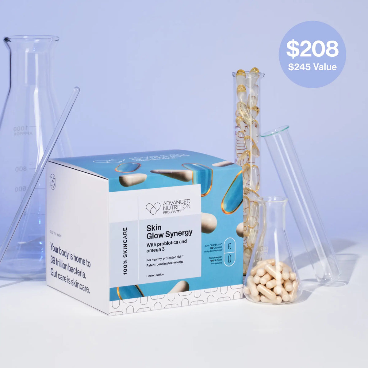 Skin care product box with supplements and test tubes on a light blue background