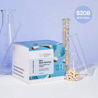 Skin care product box with supplements and test tubes on a light blue background